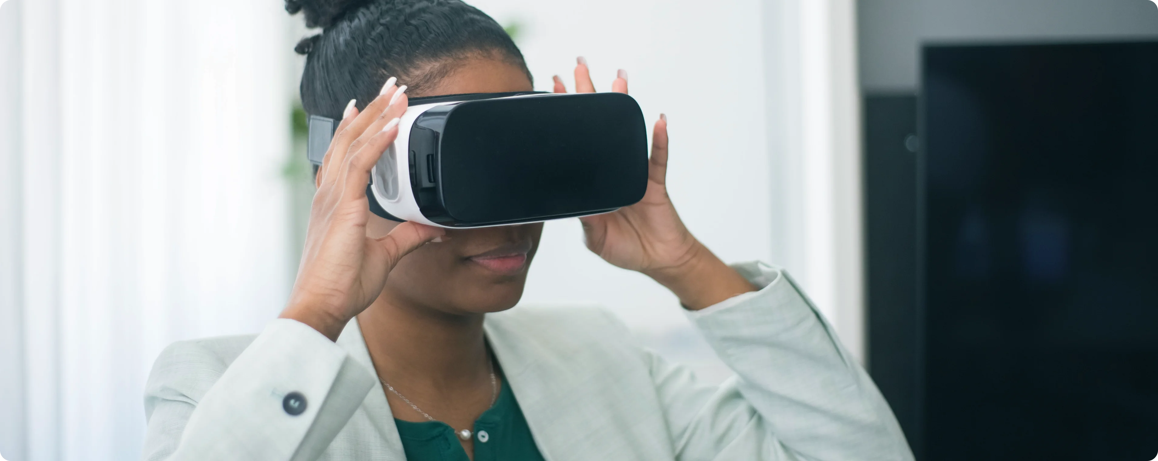 A woman exploring healthcare technology through a virtual reality headset